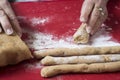 Christmas background with hands preparing czech traditional christmas cookies and sweets from homemade dough.