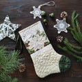 Christmas background with holiday elements. Traditional decoration. Textile quilting Christmas sock.