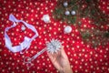 Christmas background with homemade 3D star.Hands of woman creating Christmas decoration.Xmas colorful background.Winter holiday