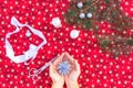 Christmas background with homemade 3D star.Hands of woman creating Christmas decoration.Xmas colorful background.Winter holiday