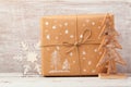 Christmas background with homemade gift box and rustic decorations