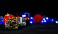 Christmas background image, red balls on the blurred background, blue lights, focus on the pine cone Royalty Free Stock Photo