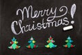 Christmas background with an inscription on chalkboard . Top view