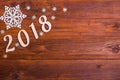 Inscription 2018 on a wooden table, top view with copy space.