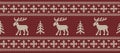 Christmas background. Knitted pattern with deers and fir trees on a red background Royalty Free Stock Photo