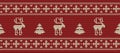 Christmas background. Knitted pattern with deers and fir trees on a red background Royalty Free Stock Photo