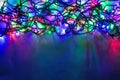 Christmas background with lights and free text space. Christmas lights. Glowing colorful Christmas lights . Royalty Free Stock Photo
