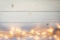 Christmas background and lights garland on wood background with