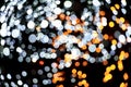 Christmas background with lights. Holiday light bulbs. Cosmic background. red, gold and black glitter lights. defocused Royalty Free Stock Photo