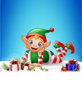 Christmas background with little elf laying on the snow Royalty Free Stock Photo