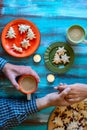 Christmas background - male and female hands holding cups of co Royalty Free Stock Photo