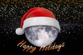 Christmas background. Moon in the starry sky in Santa`s hat Royalty Free Stock Photo