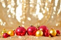 Christmas background, new year close up red and gold decoration balls on glitter abstract blurred holiday bokeh background Royalty Free Stock Photo