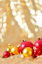 Christmas background, new year close up red and gold decoration balls on glitter abstract blurred holiday bokeh background Royalty Free Stock Photo