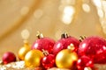 Christmas background, new year close up red and gold decoration balls on glitter abstract blurred holiday bokeh background Royalty Free Stock Photo