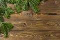 Christmas background. Nobilis fir branches, twigs on brown wooden planks. Copy space, flat lay, top view. Holiday, Xmas, New Year Royalty Free Stock Photo