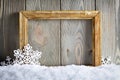 Christmas background - picture frame and snowflakes on snow Royalty Free Stock Photo