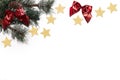 Christmas background - pine, gold stars and red ribbons on white Royalty Free Stock Photo