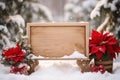 Christmas background with poinsettia flower and wooden sign. Royalty Free Stock Photo