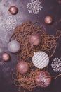 Christmas background, purple and silver balls, beads, snowflakes on a rustic background. Beautiful vintage decorations for the Royalty Free Stock Photo