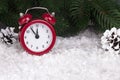 Christmas background with red alarm clock snowflakes cones and cones. Royalty Free Stock Photo