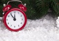 Christmas background with red alarm clock snowflakes cones and cones. Royalty Free Stock Photo