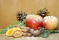 Christmas background red apples golden pineapples green pines and dried fruit Royalty Free Stock Photo