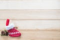 Christmas background with red baby sock xmas gift decoration on white pine wood table for boxing day, winter seasonal holiday Royalty Free Stock Photo