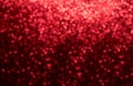 Christmas background with red bokeh lights in defocus. Romantic festive abstract blurred background