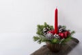 Christmas background with red candle and ornaments centerpiece Royalty Free Stock Photo