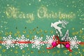 Christmas background with red silk traditional ribbon, white deer, evergreen tree and jingle bells. Royalty Free Stock Photo