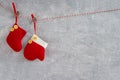 Christmas background. Red Christmas sock and mitten on gray back Royalty Free Stock Photo