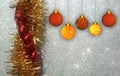 Christmas background with red and yellow ornament on a silver glitter background. Royalty Free Stock Photo