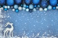 Christmas Background with Reindeer and Sparkling Blue Tree Decor Royalty Free Stock Photo