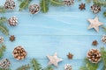 Christmas background rustic blue wooden panks with christmas tree,anice star, pine cones and fir tree. Winter holiday