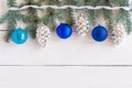 Christmas background with silver pinecone and blue baubles. New year party decoration with shiny balls. Copy space Royalty Free Stock Photo