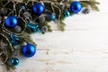 Christmas background with silver pinecone and blue ornaments Royalty Free Stock Photo