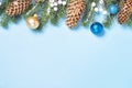 Christmas flatlay background - fir tree and decorations on blue Royalty Free Stock Photo