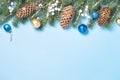 Christmas flatlay background - fir tree and decorations on blue Royalty Free Stock Photo