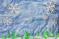 Christmas background, Snowflake with snow and christmas tree, paper cut style made of crumpled paper