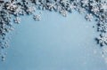 Christmas background with snowflakes on pastel blue texture. Top view, copy space. Winter flatlay. Royalty Free Stock Photo