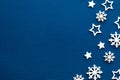 Christmas background.Snowflakes and stars on navy blue background. Royalty Free Stock Photo