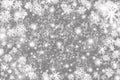 Christmas background with snowflakes, stars and place for text. Sparkly holiday background with copy space. Gray and silver
