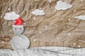 Christmas Background, Snowman wearing red Santa hat in winter with white clouds snow, paper cut made of crumpled paper Royalty Free Stock Photo