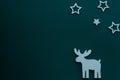Christmas background.Stars and reindeer on green background. Royalty Free Stock Photo