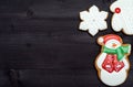 Christmas background with tasty homemade gingerbread cookies with icing on wooden table, top view, flat lay. Royalty Free Stock Photo