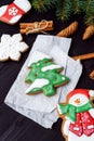 Christmas background with tasty homemade gingerbread cookies on wooden table, top view, flat lay. Royalty Free Stock Photo