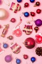 Christmas Background Christmas Toys and Decorations Red Blue Brown Christmas Balls Cones on Pink Background Vertical Toned