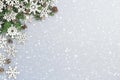 Christmas background with tree branch, cones, snowflakes and snow Royalty Free Stock Photo