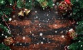 Christmas background with tree branch and decoration, gifts, snow on rustic wooden table Royalty Free Stock Photo
